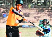 A player in action during the Panjab University Inter-College Baseball (Women) Tournament in Chandigarh 