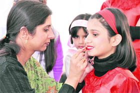 A student gets ready for a stage performance at the school annual function in Dehradun.