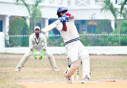 A batsman tries to hook a delivery in the 58th Dehradun Cricket League on Monday. 