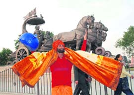 A girl tries to strike a delicate balance on rope at Sadar bus stand in Ambala Cantonment.