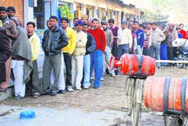 Hisar is facing an acute shortage of cooking gas as is evident from this long queue outside a gas agency office. Come winter and such serpentine queues are a common sight outside LPG agencies in the state