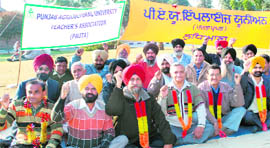 PAU employees sit on a hunger strike for the 11th consecutive day in Ludhiana on Monday.