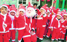 Tiny tots of St Xavier Play Way School celebrate Christmas in Ludhiana on Monday.