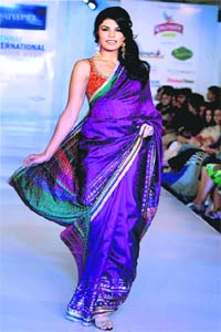 Bollywood actor Jacqueline Fernandez displays the creation of designer Satya Paul on the last day of Chennai International Fashion Week