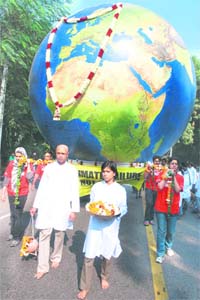 Greenpeace activists participate in a mock funeral of Earth to protest the inconclusive Copenhagen climate talks, in New Delhi