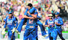 Asish Nehra (C) celebrates the dismissal Tillakaratne Dilshan in Cuttack on Monday.