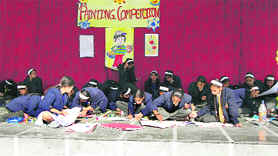 Students take part in a painting competition held at Childrens Academy in Dehradun on Tuesday.