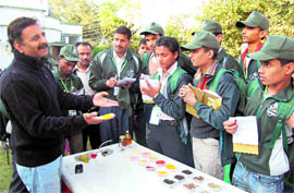 Dr Brij Mohan Sharma of SPECS teaches students from Madhya Pradesh about checking adulteration in food products at a workshop in Dehradun on Tuesday