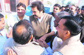 HJC chief Kuldeep Bishnoi meets party workers before addressing a press conference in Karnal on Tuesday.
