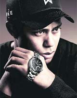 In this file photo Tiger Woods poses with a TAG Heuer watch. TAG Heuer on Monday said it will continue its partnership with Woods as its brand ambassador.