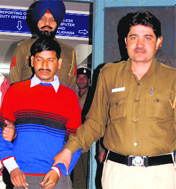 Chotu Ram, the main accused in the Nari Niketan case, at the Sector 34 police station in Chandigarh on Wednesday. 