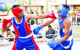 A bout of the Dehradun District Boxing Tournament in progress in Dehradun