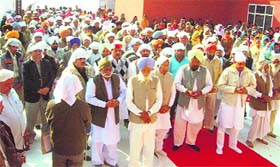 Residents and kin of victims attend an all-religion prayer meeting on the occasion of the 14th anniversary of the Dabwali fire tragedy in Dabwali