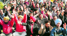 Members of the Employees Joint Action Committee hold a demonstration in Jammu on Wednesday