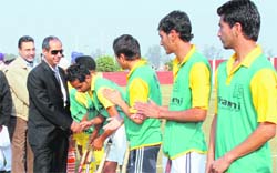 Players shake hands with the chief guest on the opening of VIIth Doraha Gold Cup Hockey Tournament.