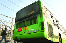 A low-floor bus catches fire in New Delhi on Thursday.
