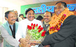 Chief Minister Ramesh Pokhriyal Nishank with former Chief Minister  BC Khanduri greet Bisan Singh Chufal on being formally elected President of the state unit of the BJP in Dehradun on Thursday.
