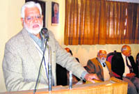 Justice Irshad Hussain (retd) addresses a workshop held on National Consumer Day in Dehradun on Thursday.