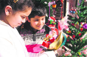 Merry Christmas: Kids on a look out for a Santa of their choice in Ludhiana.