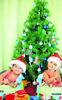 Former conjoined twins Krishna (left) and Trishna prepare for their first Christmas apart in Melbourne on Thursday