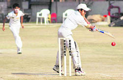 A batsman of Kundan International Cricket Academy plays a shot during a match against BTS Royal at The Banyan Tree School in Chandigarh on Friday.