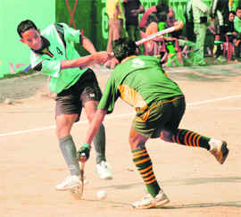 Two midfielders vie for the ball during a match at Gurukul Kangri University in Haridwar on Friday.