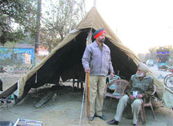 Cops operate from a makeshift tent in the Industrial Area,