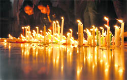 Kids light candles in the Kalvary Church to celebrate Christmas in Ludhiana on Friday