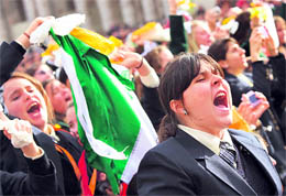 Girls shout as Pope Benedict XVI arrives to lead his Urbi et Orbi (to the city and the world) Christmas Day message from the central balcony of St Peters Square at the Vatican on Friday