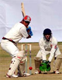 A batsman all set to hit ball during a match on Saturday