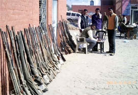 Police look after fire arms that had been deposited at the Rawatsar police station during the Lok Sabha and Vidhan Sabha polls