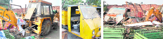 Vehicles, including a JCB machine, dumped on the premises of the Municipal Council in Bahadurgarh. 