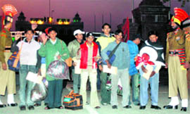 Fishermen who were released by Pakistan enter India at the Attari-Wagah checkpost on Saturday