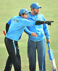 Indias Suresh Raina (L) with M S Dhoni on Saturday. 