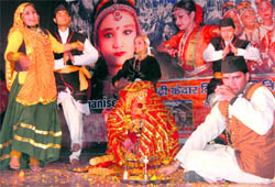 Artistes perform during a cultural programme organised by the Badri-Kedar Vikas Samiti in Dehradun on Sunday