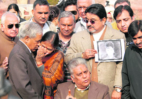 Ruchikas father Subhash Chander Girhotra (middle) along with Anand Prakash and his wife (left) in Chandigarh on Sunday.