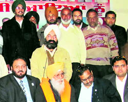 Sukhdev Singh Libra (with siropa) with local Congress leaders at the DAV High School at Mandi Ahmedgarh