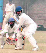 A cricket match organised by the Ludhiana District Cricket Association in progress at Dugri in Ludhiana on Sunday