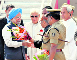 PM Manmohan Singh being weclomed at Bhubaneswar Airport during his one-day visit to Orissa on Sunday.