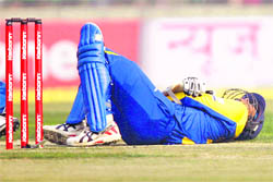 Sri Lankas Tillakaratne Dilshan lies on the ground after being hit by a Zaheer Khan delivery on Sunday. 