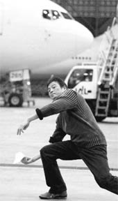 Japanese paper airplane virtuoso Takuo Toda prepares to release a 10-cm-long craft during his paper airplane fly-off in attempt to break his own record of 27.9 seconds set earlier this year, at a Japan Airlines hangar near Haneda Airport in Tokyo on Sunday. In the world of competitive paper airplane throwing, a 20-second flight is exceptional, 25 or better is world class. Thirty is the stuff that dreams are made of.