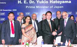 Japanese Prime Minister Yukio Hatoyama shakes hands with CII vice-president Hari Bhartiya as ICICI Bank CEO Chanda Kochhar (left) and Bajaj Auto head Rahul Bajaj (centre) look on during a CII interactive session with India Inc in Mumbai