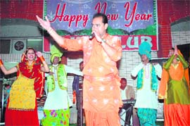Punjabi singer Bobby Sidhu performs during the New Year celebration at Elite Club in Patiala,