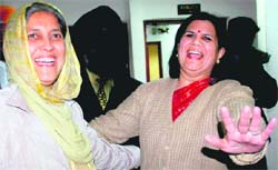 Pre-poll camaraderie: Harjinder Kaur (left) and Anu Chatrath, contenders for the post of the Mayor of the Municipal Corporation of Chandigarh (MCC), strike a pose ahead of the January 1 election, in Chandigarh