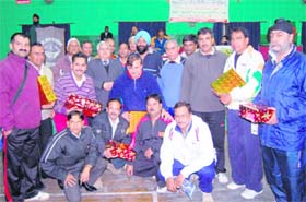 Winners of the Dehradun Seniors Badminton Championship pose for a picture in Dehradun