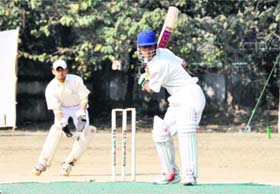 A batsman in action at the exhibition match between Uttar Pradesh XI and Uttarakhand XI organised by the Uttarakhand Cricket Association in Dehradun