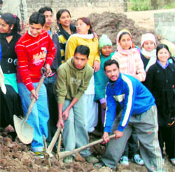 NSS volunteers of Government College at Dharamsala participate in a cleanliness drive on Dal Lake in McLeodganj on Monday
