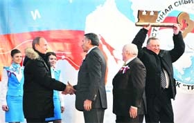 Russias Prime Minister Vladimir Putin (2nd from left) takes part in the launching ceremony of the Eastern Siberia-Pacific Ocean oil pipeline at the Kozmino oil-loading port in the bay of Kozmino