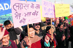Activists of the Himalayan Buddhist Cultural Association hold a protest in Jammu on Monday