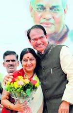 grand welcome: BJP leader Sushma Swaraj being welcomed by Madhya Pradesh Chief Minister Shivraj Singh Chouhan on her first visit to the state after taking over as Leader of Opposition in Lok Sabha, in Bhopal on Monday
